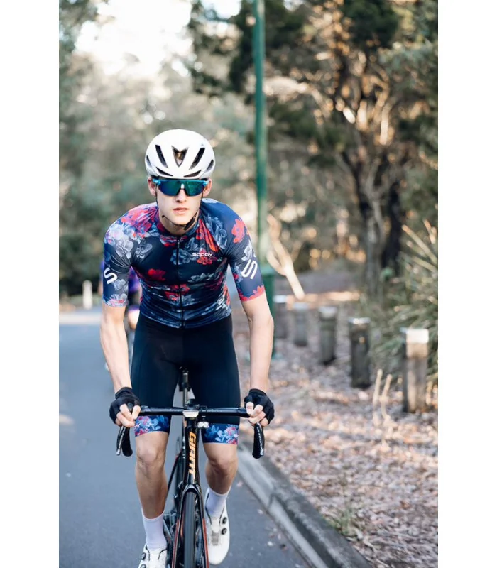 Hana Navy Jersey with subtle floral detail with Black bibs with matching cuffs | Cycling Gear