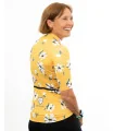 A cycle jersey with a buttercup yellow body with scattered white flowers | Cycling Jersey